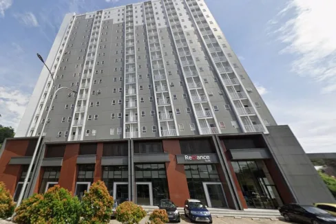 Tall Grey and White High rise Residential Building with a Red brick Ground Floor and Glass Entrances Cars Parked out Front  Rooma21com