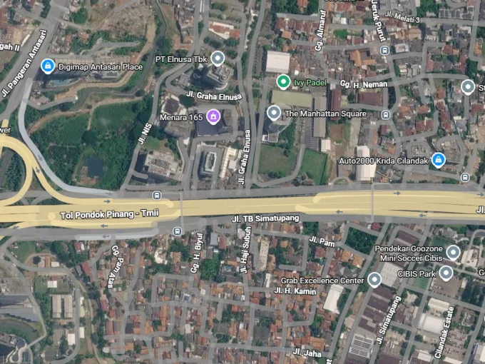 Aerial view of a multilane highway interchange with looping ramps and surrounding streets labeled around it.
